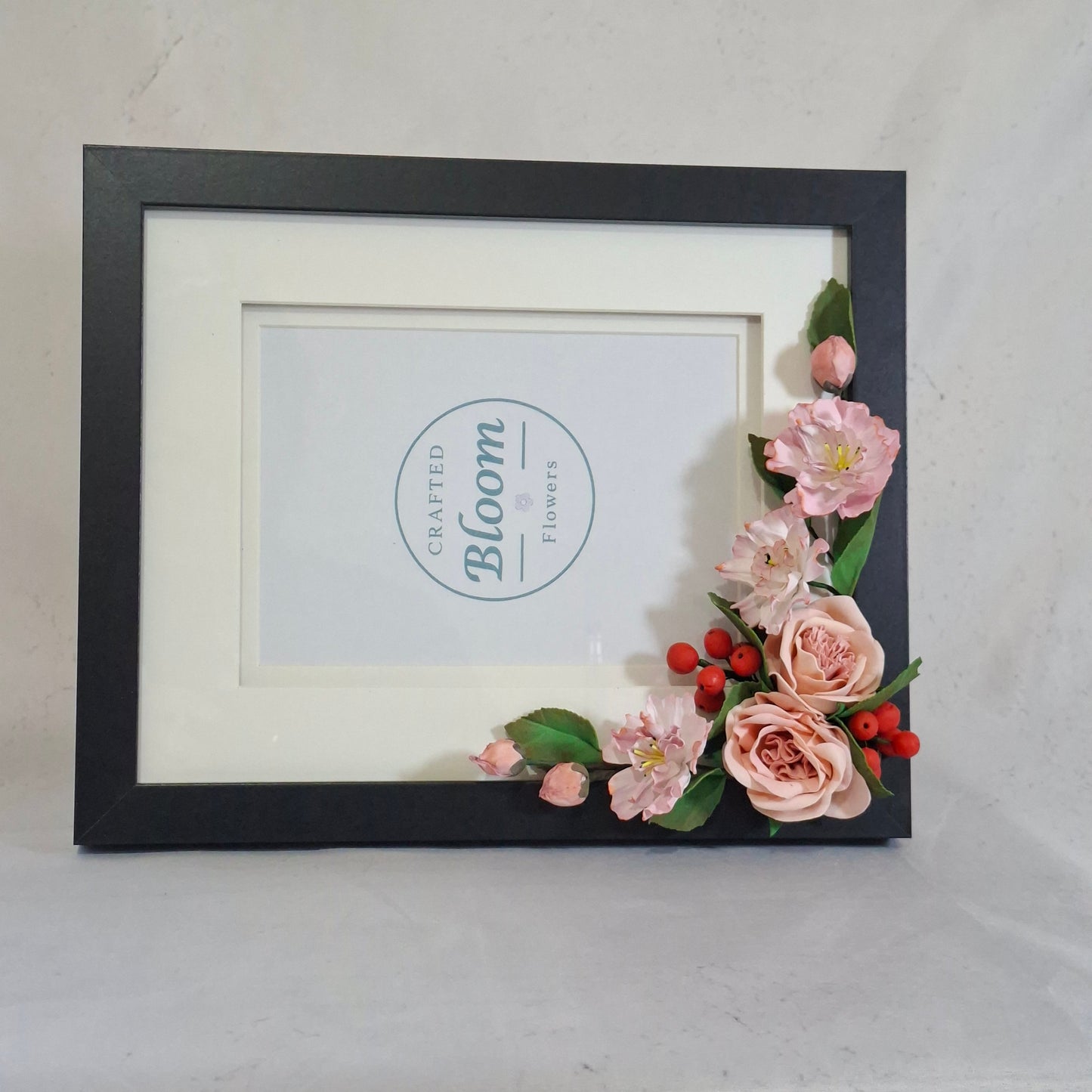 Handmade floral photo frame decorated with pink flowers. perfect for children's photo, gifts, and elegant home decor.