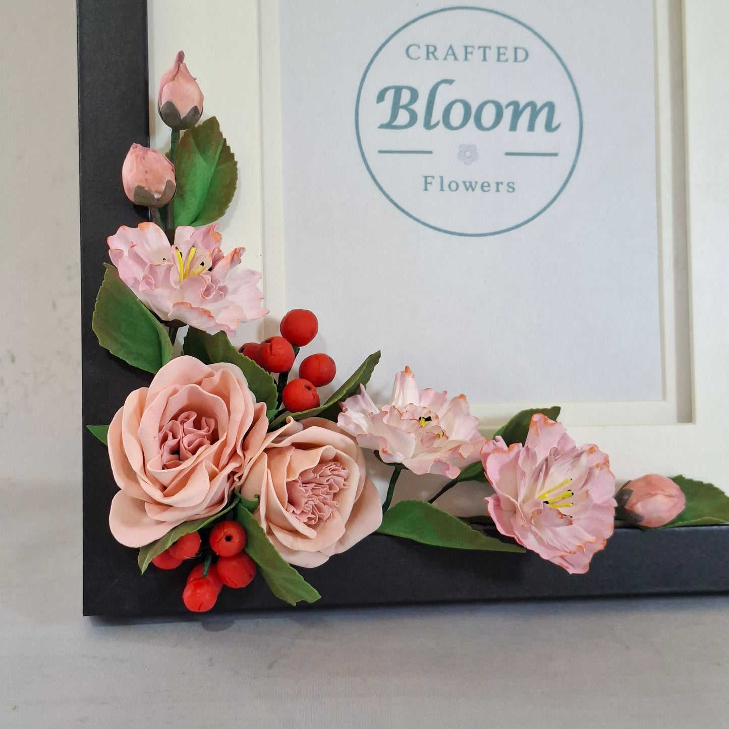 Handmade floral picture frame with pink flowers for home decoration and memory photos