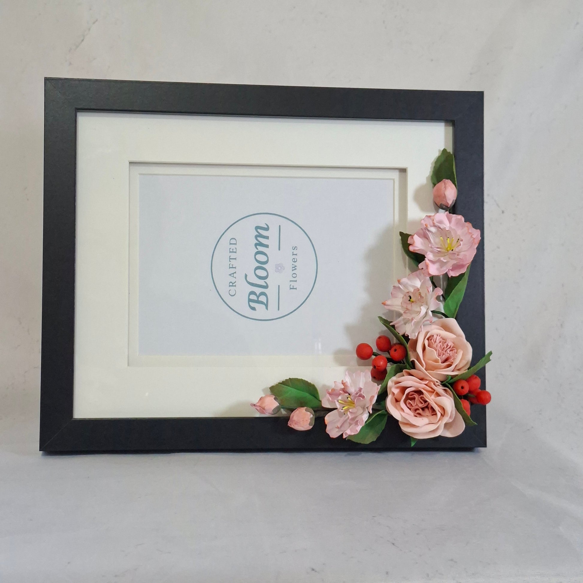 Handmade floral photo frame decorated with pink flowers. perfect for children's photo, gifts, and elegant home decor.