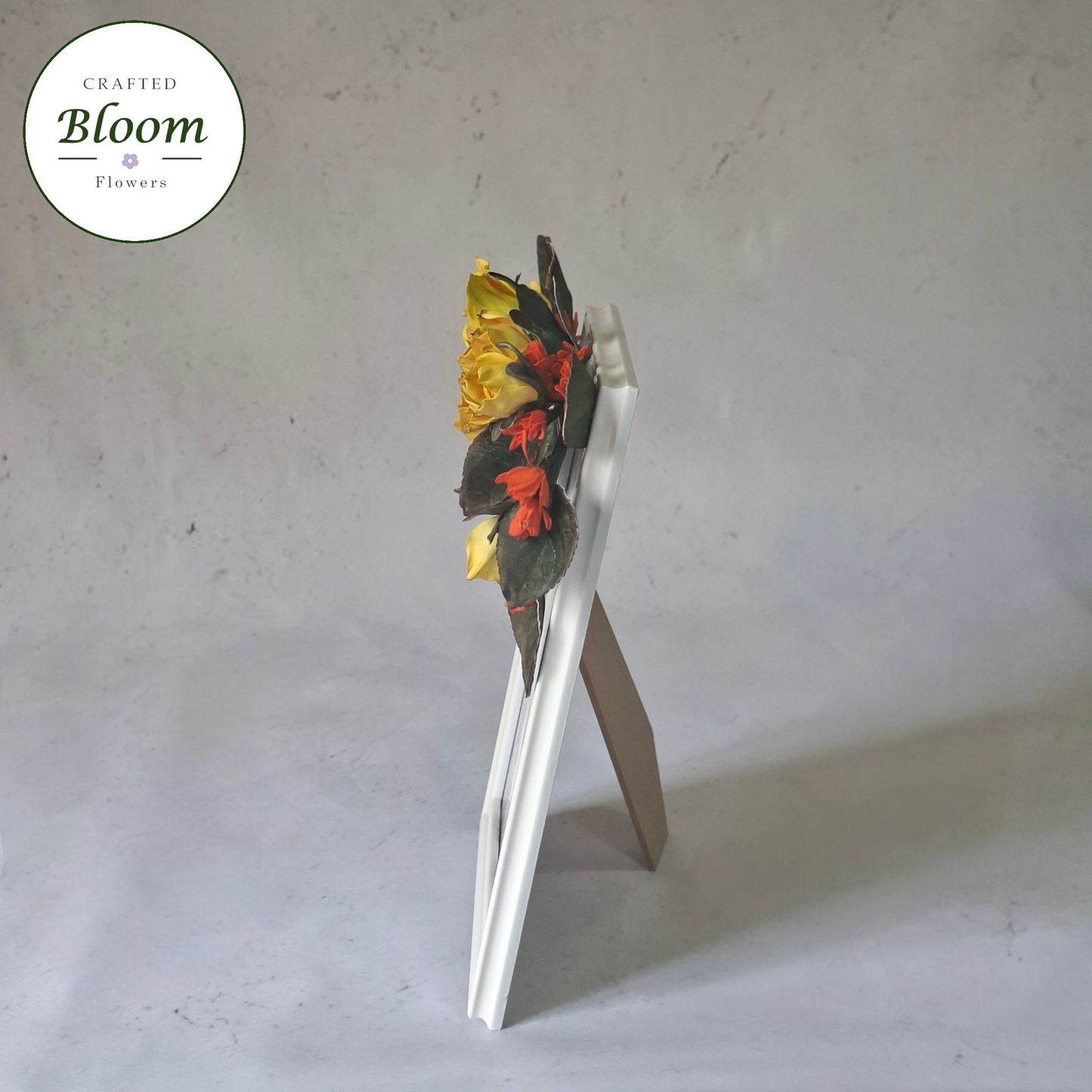 Golden Bloom floral picture frame styled on a neutral tabletop backdrop, ideal for home decor