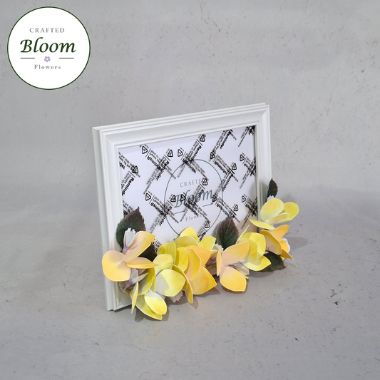 Yellow Foamiran hydrangea photo frame on white shelf