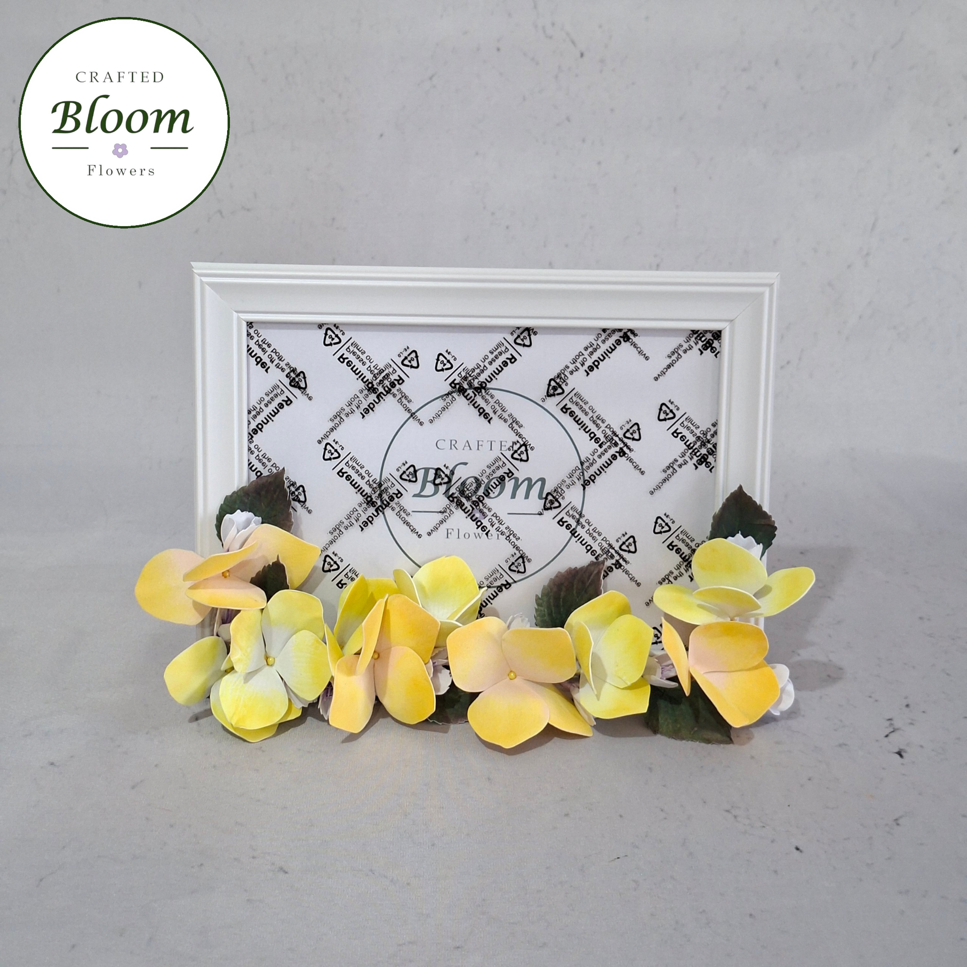 Close-up of handmade foamiran hydrangea flower on picture frame