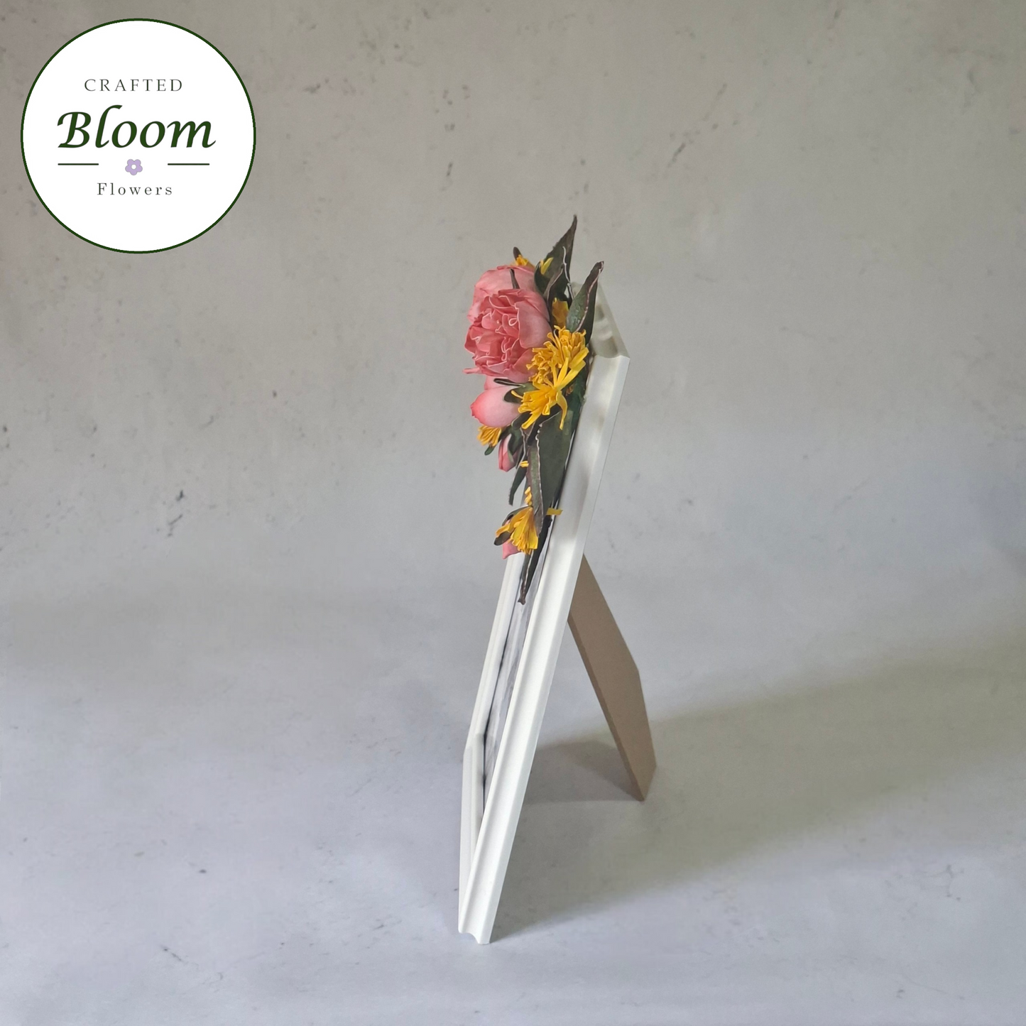 White picture frame with pink and yellow floral border, handmade in Ireland
