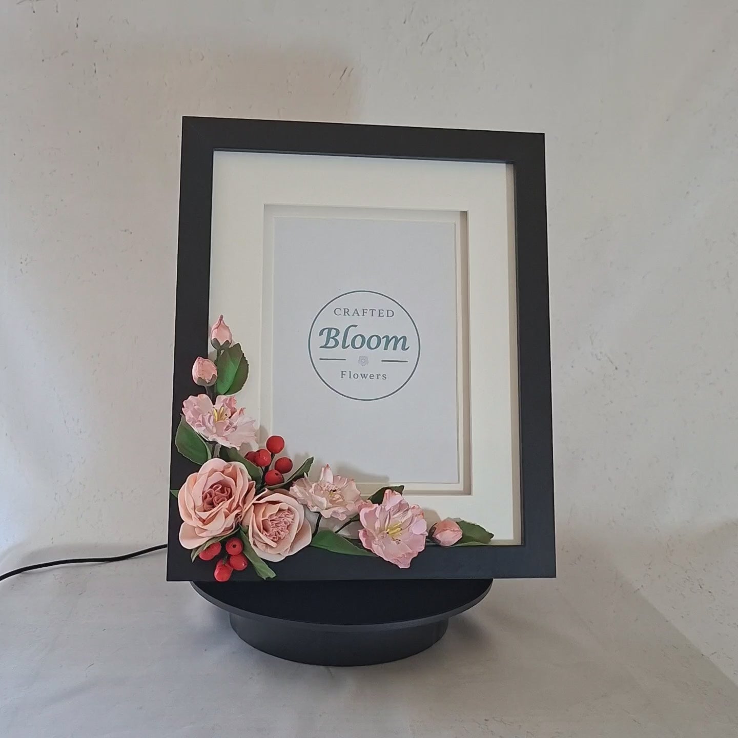 Beautiful handmade flower photo frame with delicate  pink roses. A unique decoration frame for kids photo or special gifts.